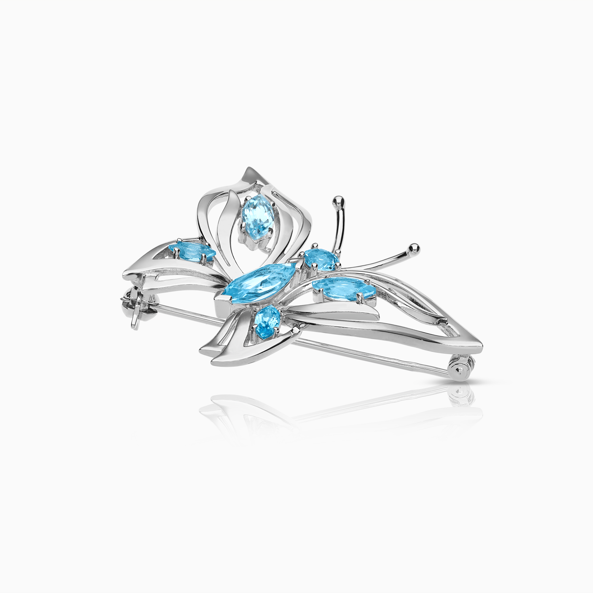 Brosch med ljusblå topaser 8,40g 18K vitguld