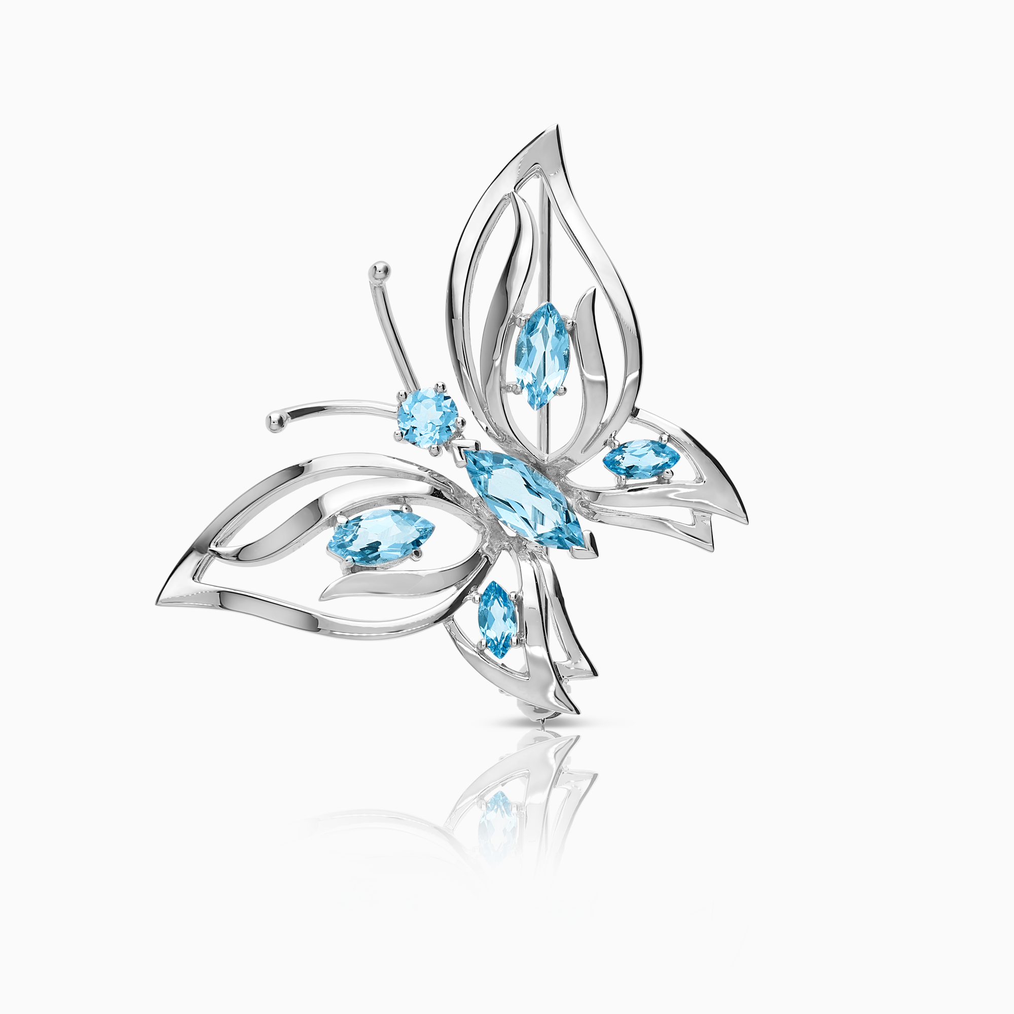 Brosch med ljusblå topaser 8,40g 18K vitguld