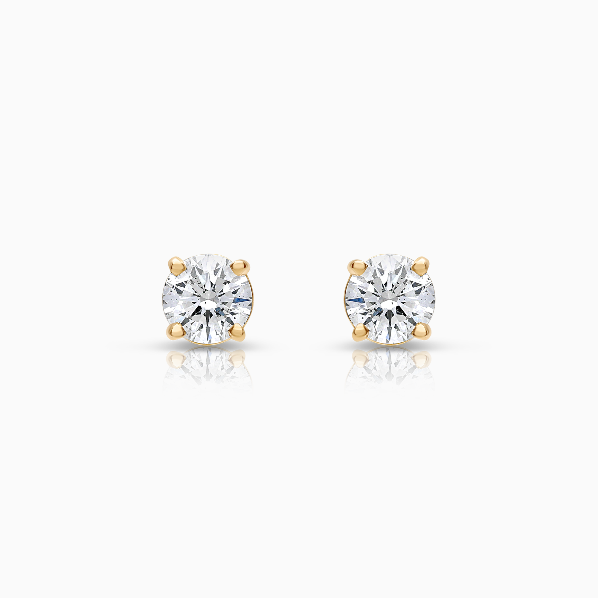 Solitaire øredobber 0,62ct 18K gull